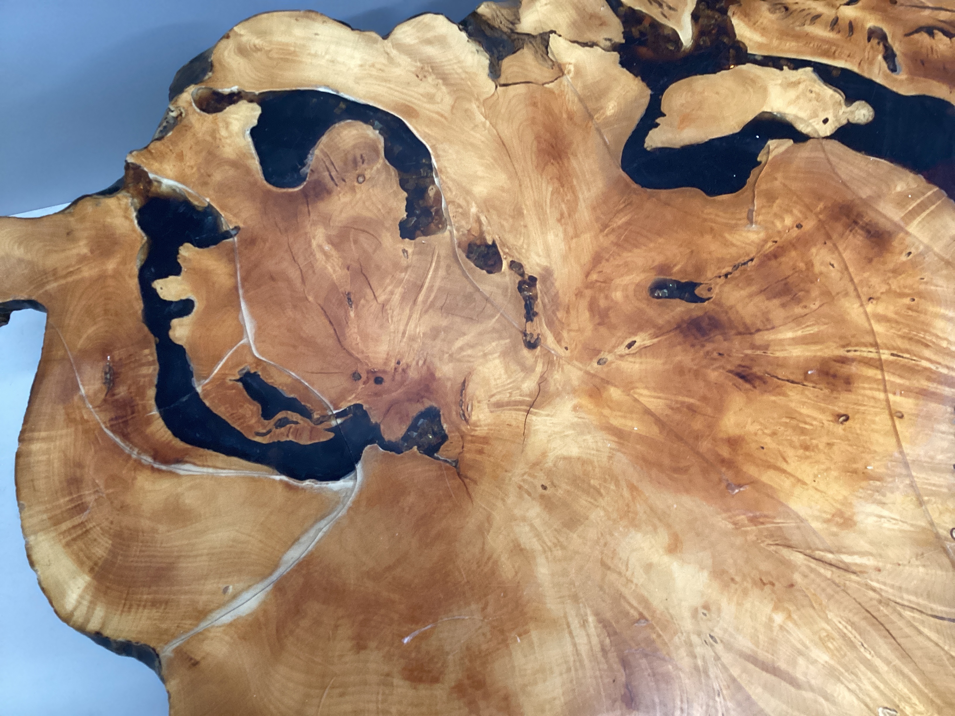 An American redwood and coloured resin trunk section coffee table circa 1970, width 130cm, depth 90cm, height 37cm